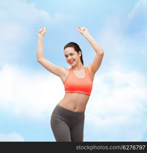 fitness and diet concept - smiling teenage girl in sportswear dancing