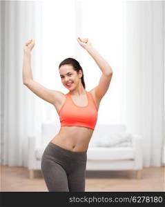 fitness and diet concept - smiling teenage girl in sportswear dancing