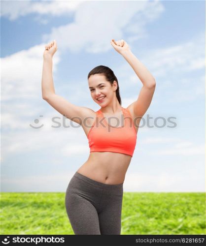 fitness and diet concept - smiling teenage girl in sportswear dancing