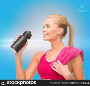 fitness and diet concept - sporty woman with special sportsman bottle and towel