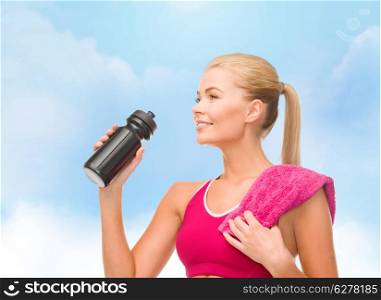 fitness and diet concept - sporty woman with special sportsman bottle and towel