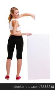 Fitness and health lifestyle advertisement. Young woman girl holding presenting pointing blank empty banner ad copyspace isolated on white background.