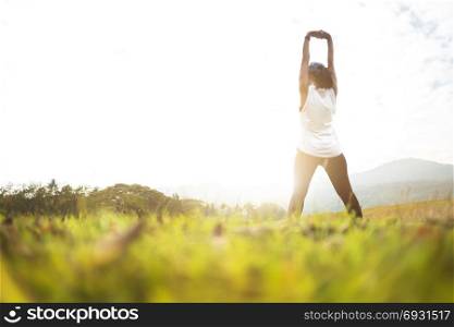 fitness athlete woman exercise workout stretching before jogging at a outdoor nature park