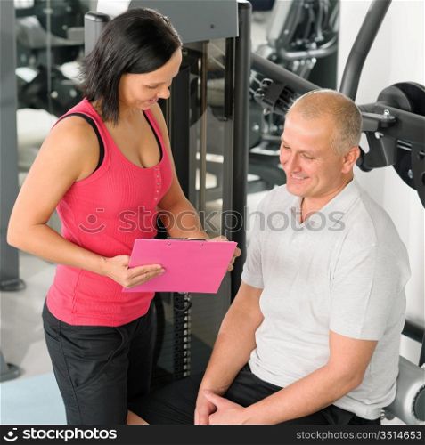 Fitness center personal plan happy active man with trainer