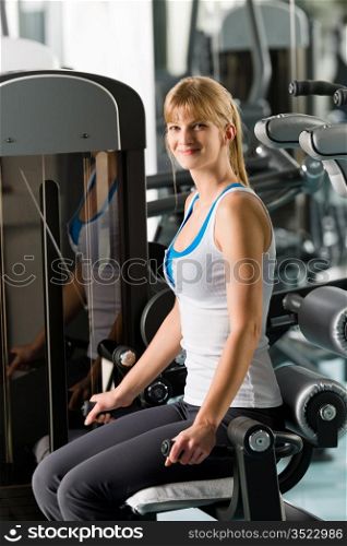 Fitness center young woman workout at gym