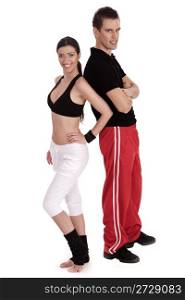 Fitness couple standing together over white background