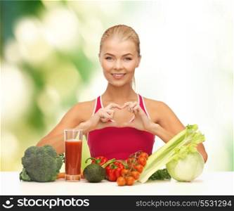 fitness, diet and food concept - smiling woman with organic food showing heart shape with hands