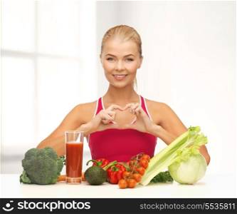 fitness, diet and food concept - smiling woman with organic food showing heart shape with hands