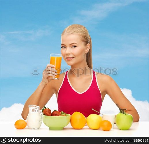 fitness, diet and healthcare concept - smiling young woman with healthy breakfast and drinking orange juice