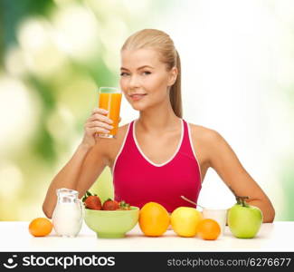 fitness, diet and healthcare concept - smiling young woman with healthy breakfast and drinking orange juice