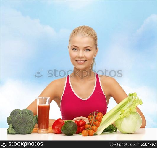 fitness, diet and healthcare concept - smiling young woman with organic food on the table