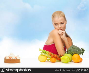 fitness, diet, health and food concept - doubting woman with fruits and pie