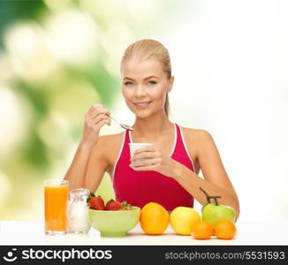 fitness, diet, health and food concept - young woman eating healthy breakfast