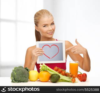 fitness, diet, technology, health and food concept - sporty woman with fruits and vegetables pointing at tablet pc