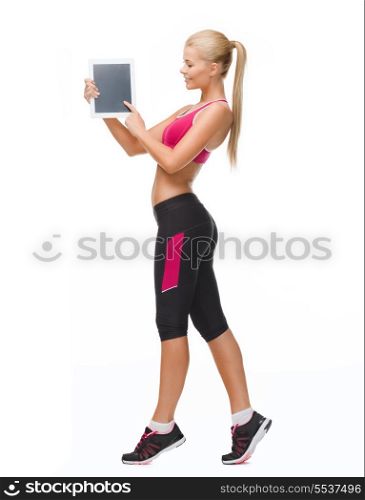 fitness, dieting, technology and healthcare concept - sporty woman showing something on tablet pc screen