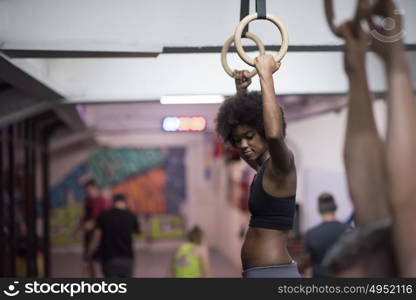 Fitness dip ring beautiful young african american woman workout at gym dipping exercise