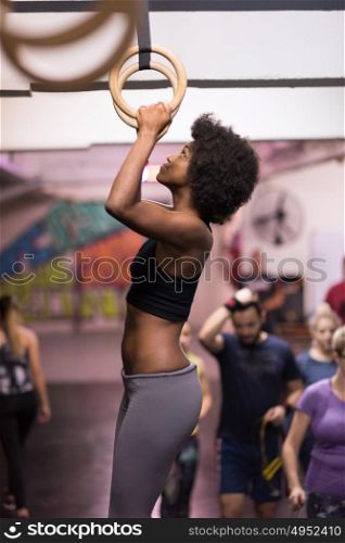 Fitness dip ring beautiful young african american woman workout at gym dipping exercise