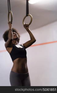 Fitness dip ring beautiful young african american woman workout at gym dipping exercise