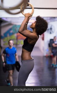 Fitness dip ring beautiful young african american woman workout at gym dipping exercise