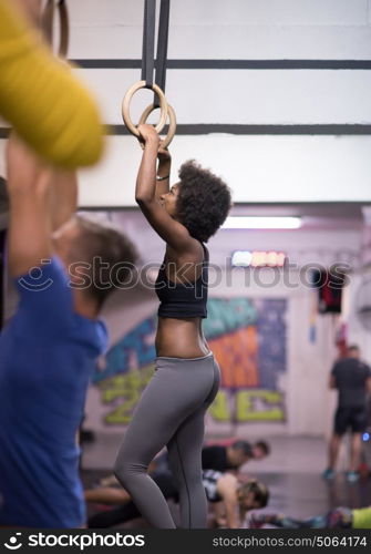 Fitness dip ring beautiful young african american woman workout at gym dipping exercise