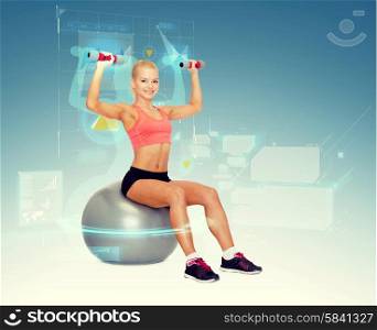 fitness, exercise and diet concept - smiling sporty woman with dumbbells sitting on fitness ball