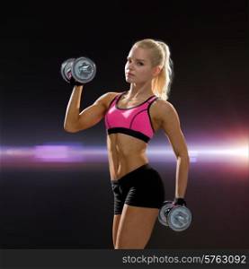fitness, exercising and dieting concept - sporty woman with heavy steel dumbbells