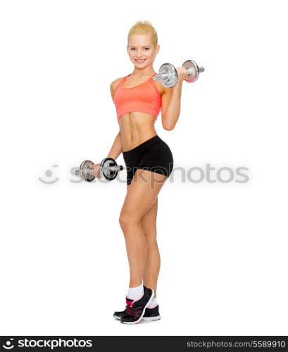 fitness, exercising and exercise concept - smiling sporty woman with heavy steel dumbbells