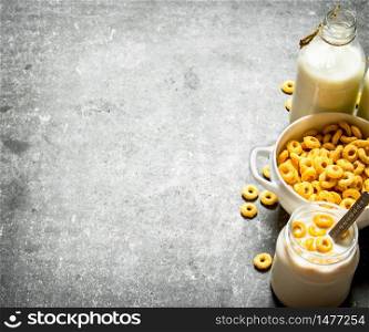 Fitness food. Corn cereal with milk. On the stone table. Fitness food. Corn cereal with milk.