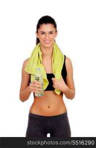 Fitness girl with a towel drinking water isolated on a white background