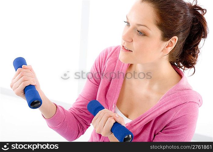 Fitness happy woman exercise with dumbbell on white