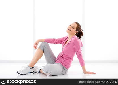 Fitness happy woman in sportive outfit on white