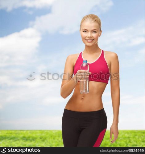 fitness, health and diet concept - sporty woman with bottle of water