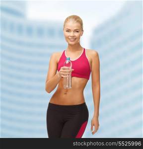 fitness, health and diet concept - sporty woman with bottle of water