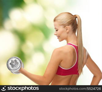 fitness, health and diet concept - young sporty woman with heavy steel dumbbell