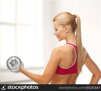 fitness, health and diet concept - young sporty woman with heavy steel dumbbell