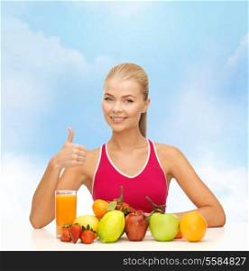 fitness, healthcare and diet concept - smiling woman with organic food or fruits on table