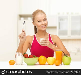 fitness, healthcare and diet concept - smiling young woman eating healthy breakfast