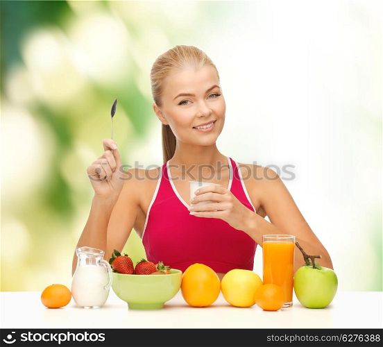 fitness, healthcare and diet concept - smiling young woman eating healthy breakfast