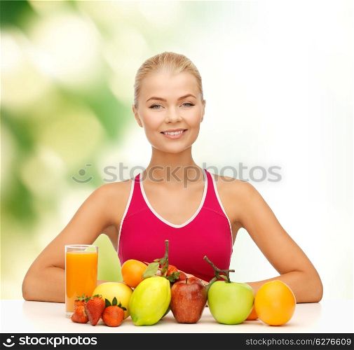 fitness, healthcare and diet concept - smiling young woman with organic food or fruits on table