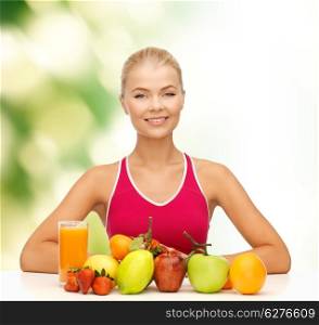 fitness, healthcare and diet concept - smiling young woman with organic food or fruits on table