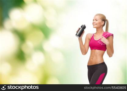 fitness, healthcare and dieting concept - smiling sporty woman drinking water from sportsman bottle