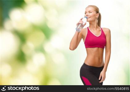 fitness, healthcare and dieting concept - smiling sporty woman with bottle of water
