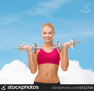 fitness, healthcare and dieting concept - young sporty woman lifting steel dumbbells