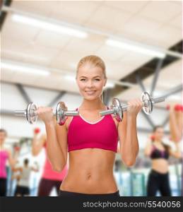 fitness, healthcare and dieting concept - young sporty woman lifting steel dumbbells