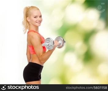 fitness, healthcare and exercise concept - young sporty woman with heavy steel dumbbell