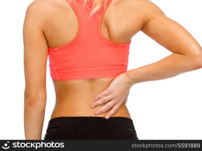 fitness, healthcare and medicine concept - close up of sporty woman touching her back