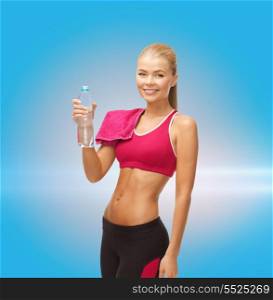 fitness, heatl and diet concept - sporty woman with bottle of water and towel