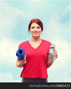 fitness, home and diet concept - smiling teenage girl with bottle of water and yoga mat after exercising at home