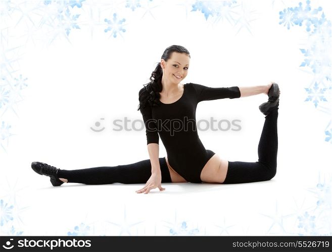 fitness instructor in black leotard with snowflakes