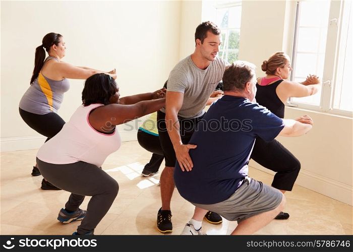 Fitness Instructor In Exercise Class For Overweight People